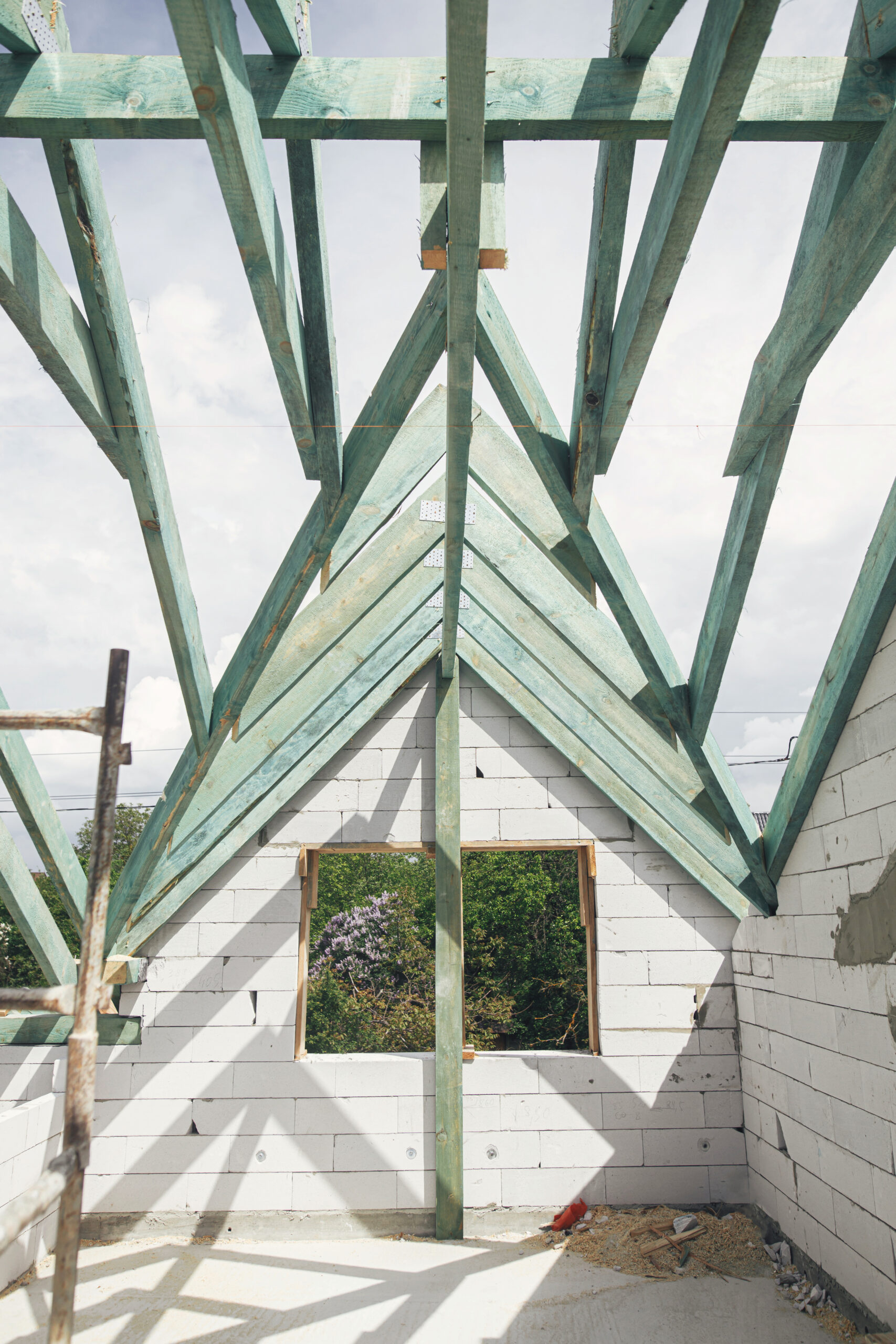 unfinished roof trusses, view in attic with rafters and beams ag